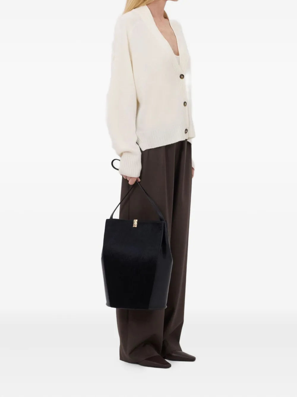 The Kaia LDS V Neck Cardigan in Ivory laid flat, emphasizing its straight fit and three front buttons.