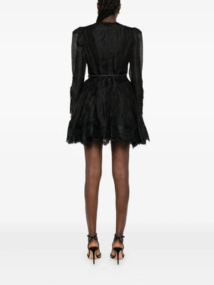 Back view of Hypnotic Lace Trim Mini Dress in Black, emphasizing the design and elegant silhouette.