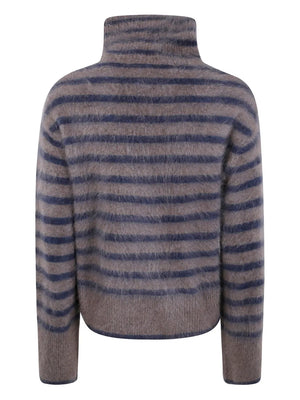 Casual view of Lisa Yang's Floren Sweater in Truffle/Night Fall Brushed Stripes, showcasing the soft texture and elongated sleeves.