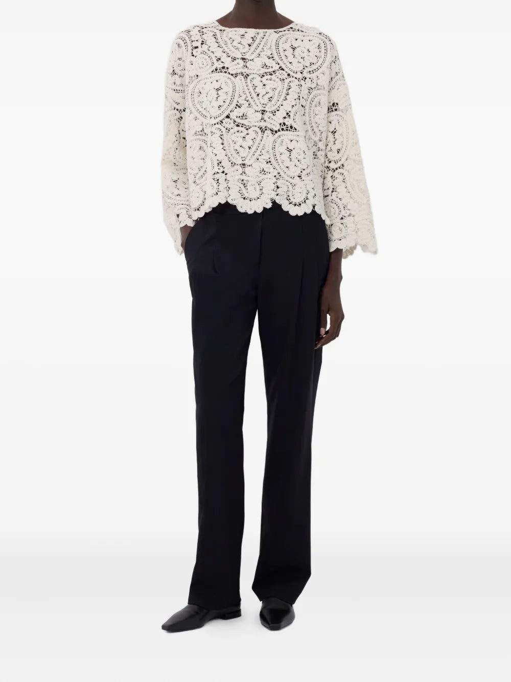 Model wearing the Arold Sweater in Ivory, highlighting the elegant boat neck and long sleeves.