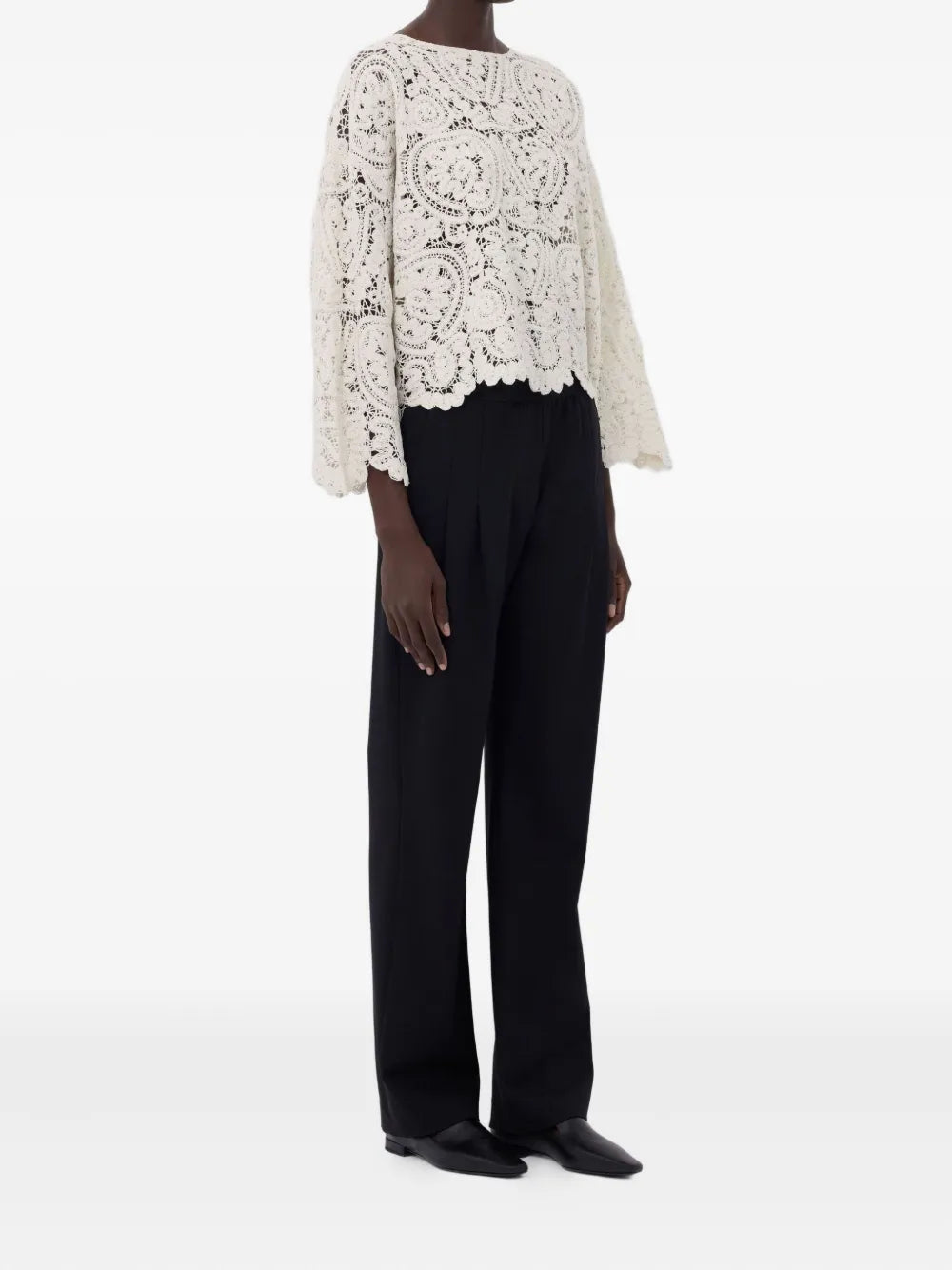 Detailed view of the Arold Sweater in Ivory, emphasizing the unique ample fit and delicate design.