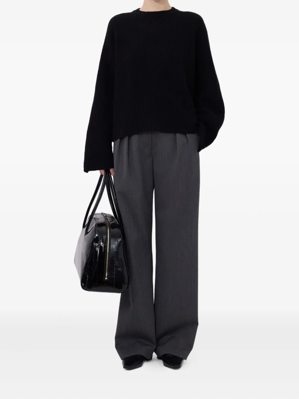 Close-up of Axel Ribbed Cashmere Sweater in Black, highlighting the soft cashmere material.
