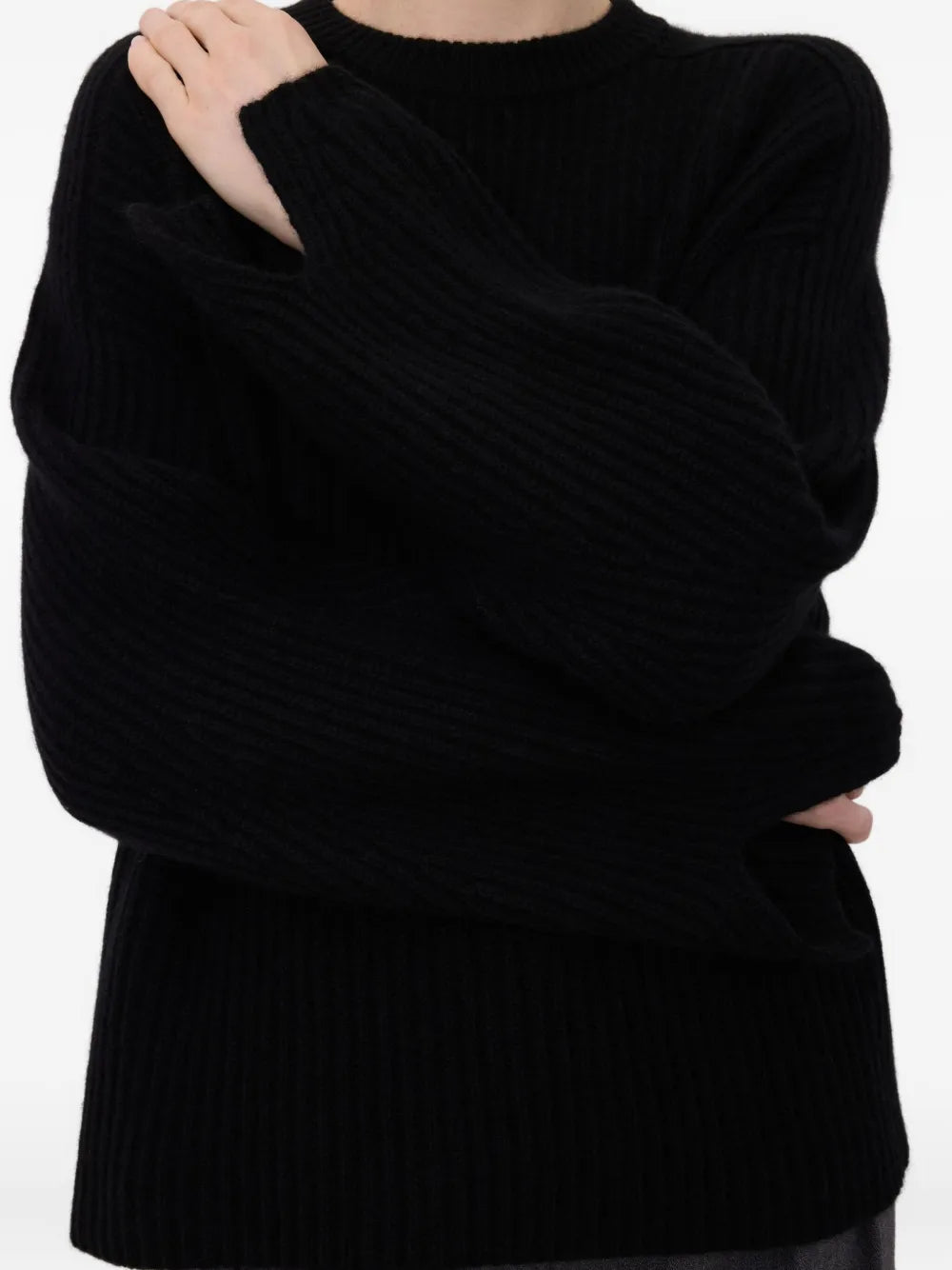 Flat lay of Axel Ribbed Cashmere Sweater in Black, emphasizing its classic crew neck design and luxurious fabric.