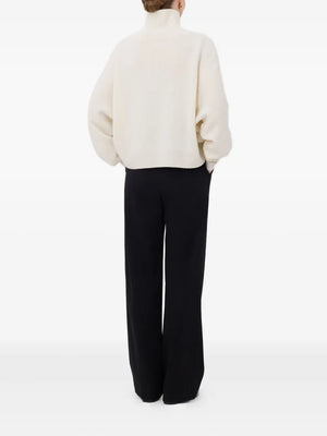 Back view of the Luke Stand Collar Sweater in Ivory, emphasizing the straight fit and ribbed cuffs.