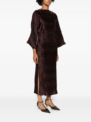 Elegant Tralaido Dress in Coffee Brown by Malene Birger, perfect for evening wear with its ankle-gracing silhouette.