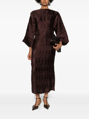 Stylish view of the Tralaido Dress in Coffee Brown, featuring an adjustable belt and flattering boat neckline.