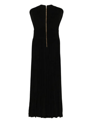 Close-up of the Hypnotic Column Dress in Black featuring the designer's signature heavy gathering details, perfect for a chic evening look.