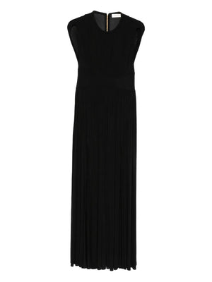 Hypnotic Column Dress in Black from Zimmermann's Fall 2025 Collection, showcasing its elegant maxi style with gathered neckline and front skirt splits.