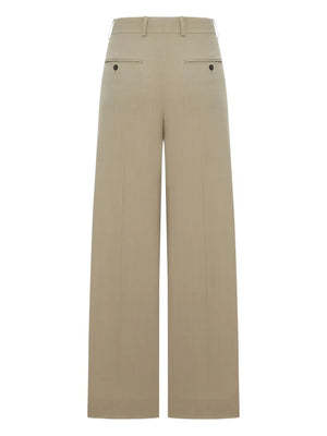Full outfit styling of the Wide Fluid Trousers in Taupe by TOTEME, perfect for versatile looks.