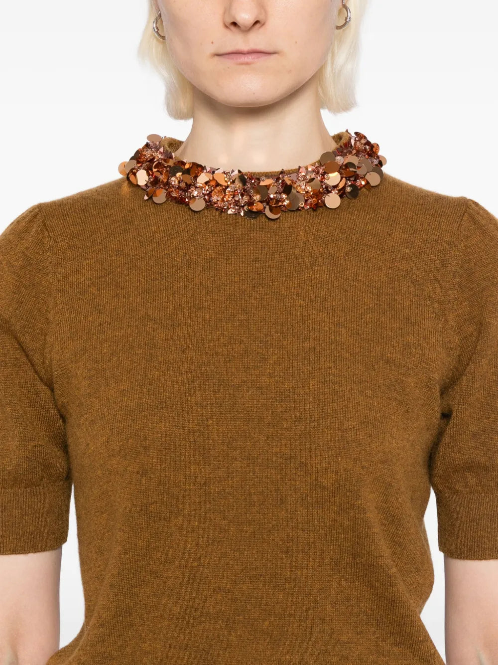 Lifestyle image of a model wearing the Liv Embroidered Cashmere Short Sleeve Knit in Umber by Ulla Johnson, perfect for any elegant occasion.