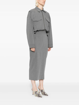 Stylish model wearing the Scout Dress in Static Grey with pockets, showcasing its versatile design.