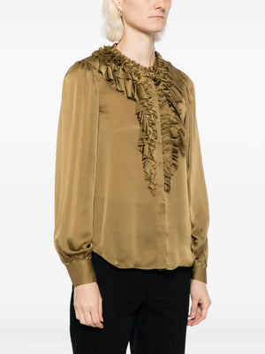 Model wearing the Rouen Blouse in Willow, highlighting its distinctive ruffled details and stylish silhouette.