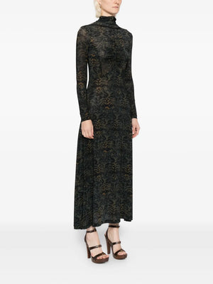 Model wearing Koa Dress in Desert Jasper, perfect for a chic summer look with a flattering maxi silhouette.