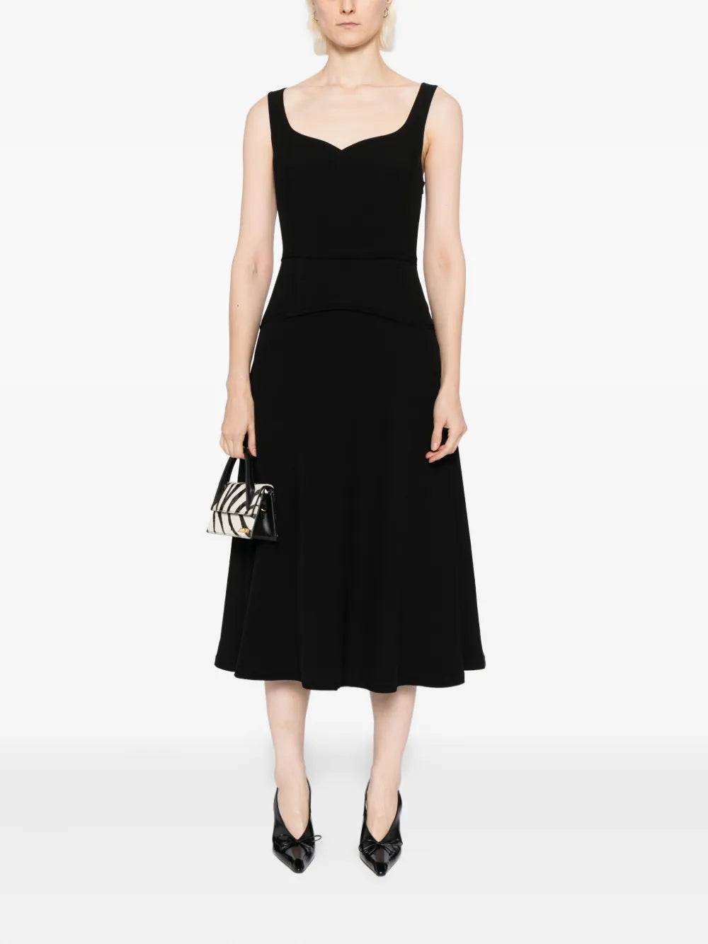 High-quality close-up of the Ulla Johnson Vivi Midi Dress in Noir showcasing tonal seam detailing.