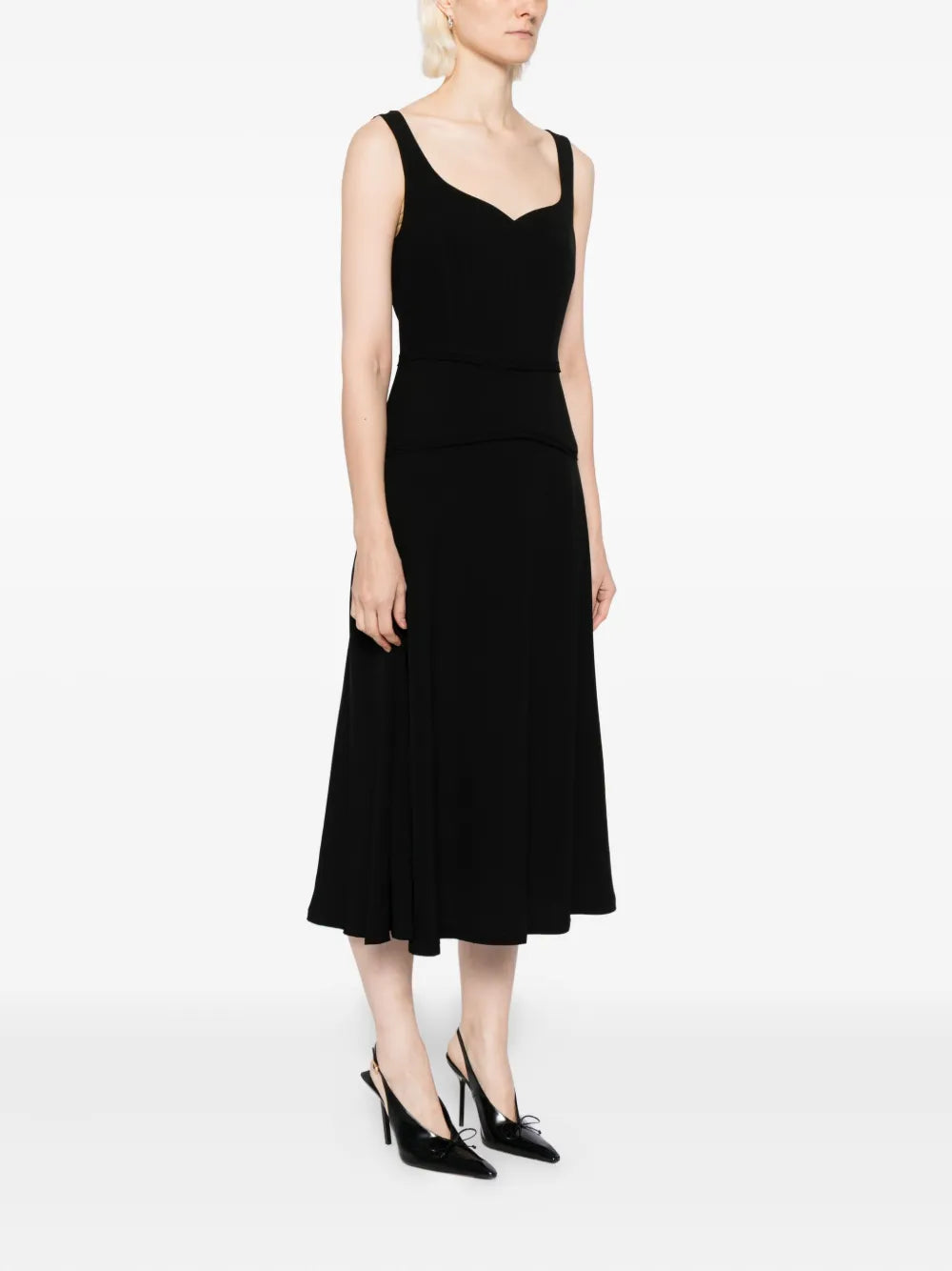Ulla Johnson Vivi Midi Dress in Noir worn by a model, highlighting its elegant midi length and flattering silhouette.