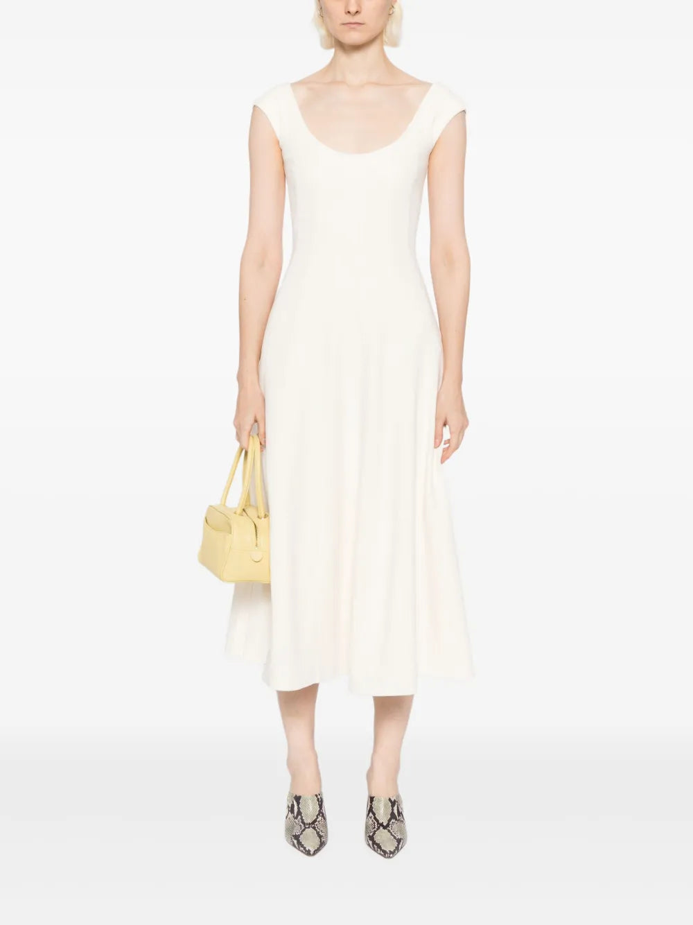 Close-up of Staud Charlotte Dress in Ecru with a-line skirt and elegant design details.