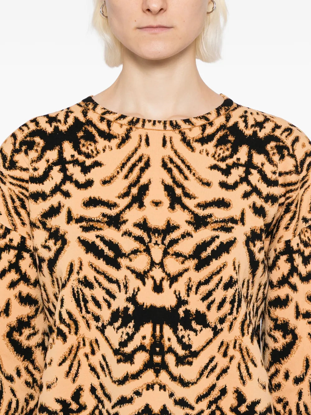 Ulla Johnson's Cade Pullover in Bengal displayed on a mannequin highlighting its chic cold-weather style.