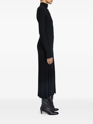 The stylish Jada Dress in Black displayed on a model, highlighting its flexible button-front and sophisticated design.