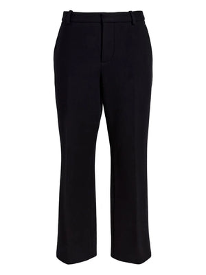 Proenza Schouler Ismene Pant in Black showcasing a tailored mid-rise silhouette with a cropped length and slight flare at the ankle.