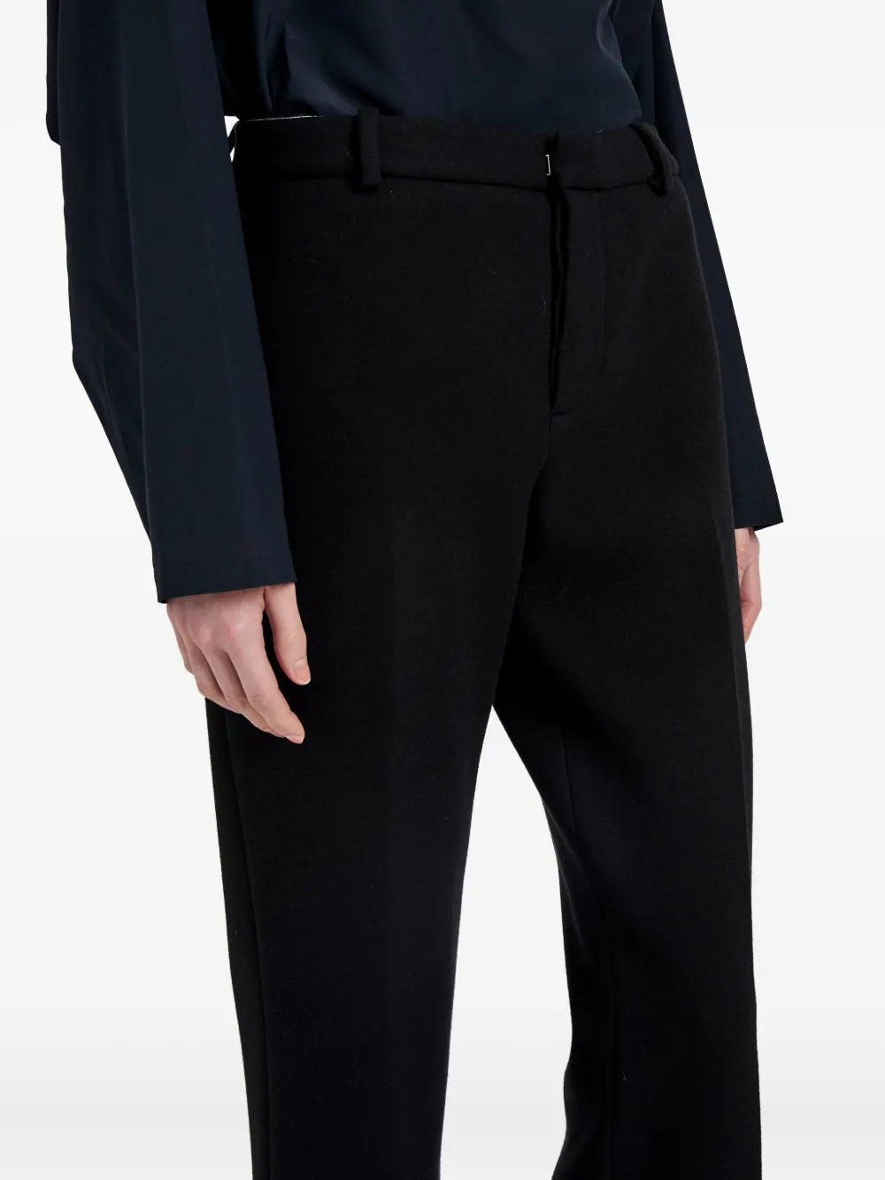 Flat lay of the Proenza Schouler Ismene Pant in Black on a white background, detailing the luxurious wool composition.