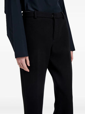 Flat lay of the Proenza Schouler Ismene Pant in Black on a white background, detailing the luxurious wool composition.