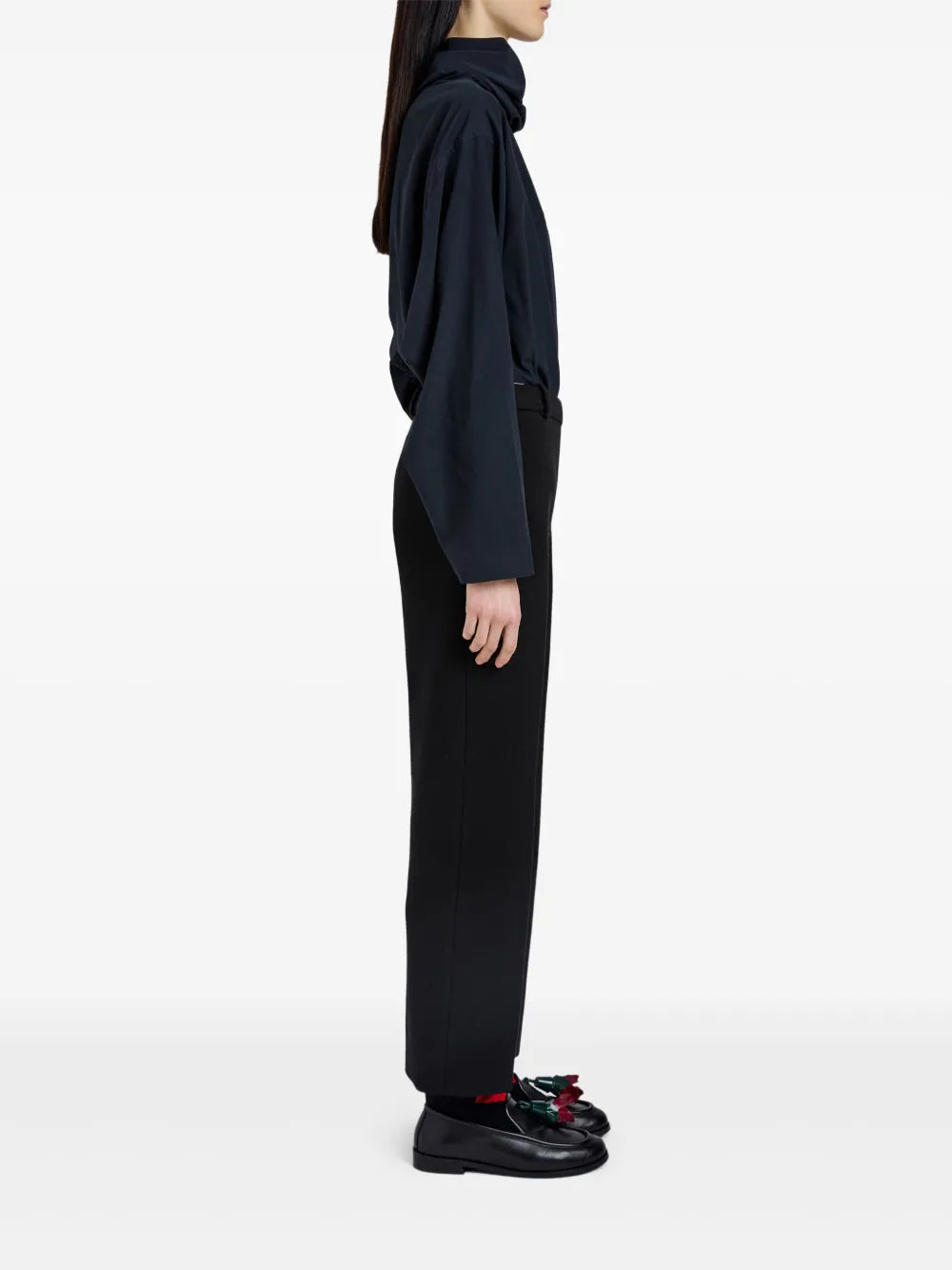 Stylish model wearing Proenza Schouler Ismene Pant in Black, displayed in a chic urban setting.