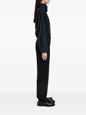 Stylish model wearing Proenza Schouler Ismene Pant in Black, displayed in a chic urban setting.