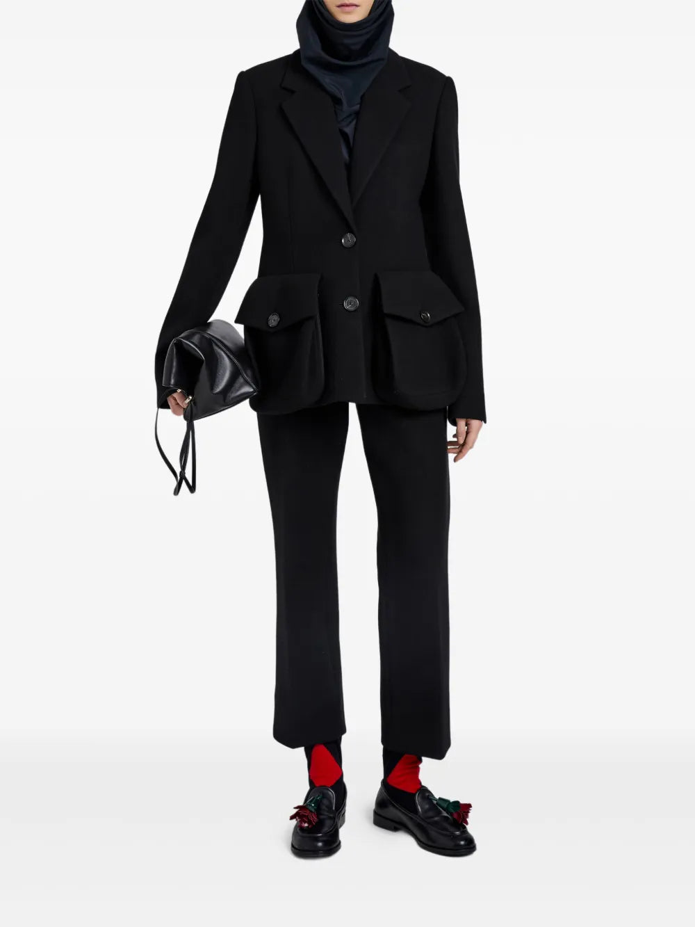 Close-up view of the Proenza Schouler Ismene Pant in Black highlighting the wool scuba fabric and concealed front fastening.