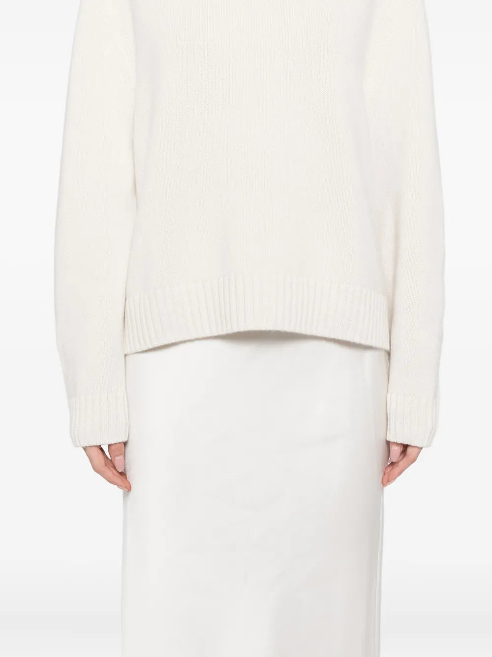 New Saddle Crewneck Sweater in Ivory featuring a detailed view of the fully fashioned arm holes.