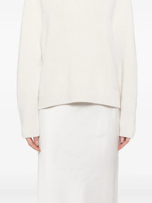New Saddle Crewneck Sweater in Ivory featuring a detailed view of the fully fashioned arm holes.