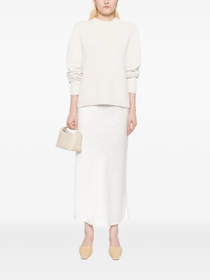 Close-up of the New Saddle Crewneck Sweater in Ivory highlighting the soft cashmere texture.