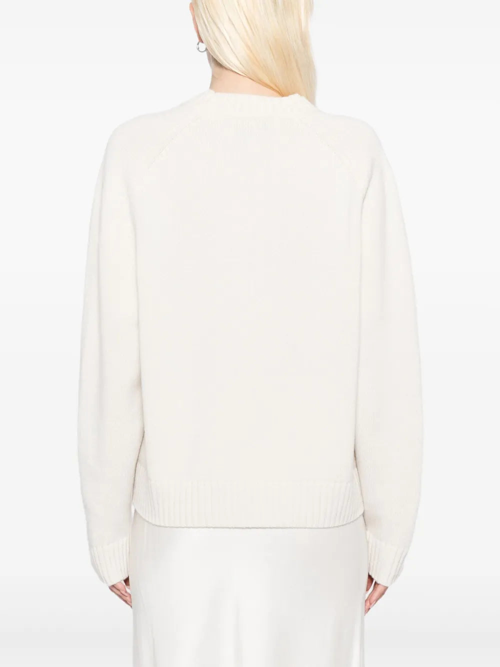 New Saddle Crewneck Sweater in Ivory worn by a model, emphasizing its stylish design.