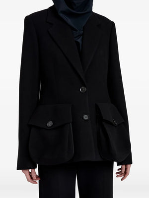 Model wearing the stylish Silva Jacket in Black by Proenza Schouler, tailored for a modern look.