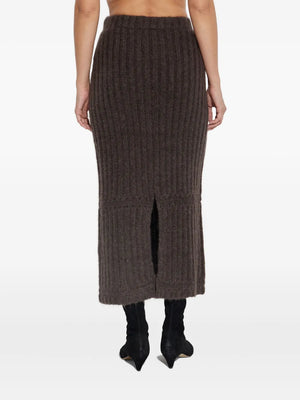 Sofia Maxi Skirt in Carafe styled with the matching Revna sweater vest, ideal for layering in the fall.