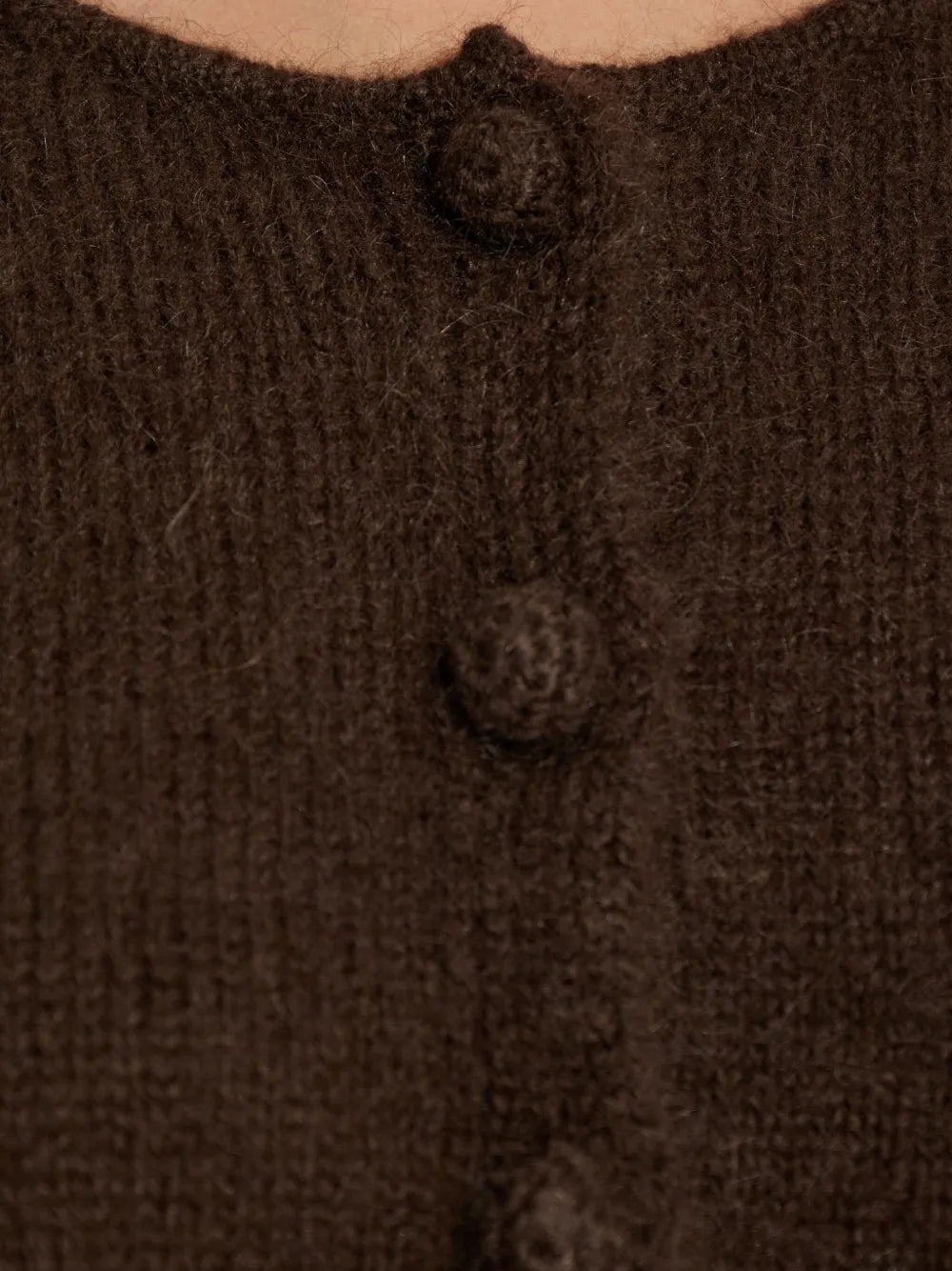 Zharea Cardigan in Dark Mahogany folded neatly to display its rich color and elegant texture.