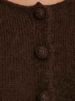 Zharea Cardigan in Dark Mahogany folded neatly to display its rich color and elegant texture.