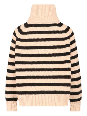 Close-up of Nili Lotan's Raelynn Cashmere Sweater in Parchment/Black highlighting the turtleneck and zip-up neck detail.