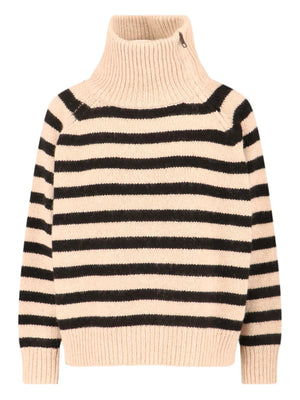 Raelynn Cashmere Sweater in Parchment/Black showcasing a boxy fit and chunky texture.