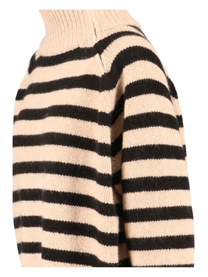 Model wearing Raelynn Cashmere Sweater in Parchment/Black, highlighting its stylish raglan sleeves and double layer trim.