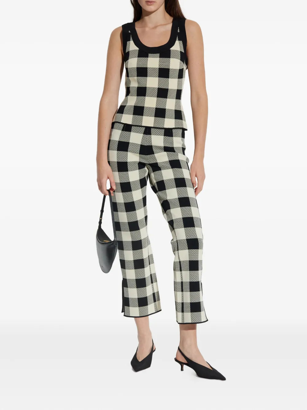 Close-up view of the Pippa Pants in Heritage Plaid featuring kick-flare trousers and a high waist.