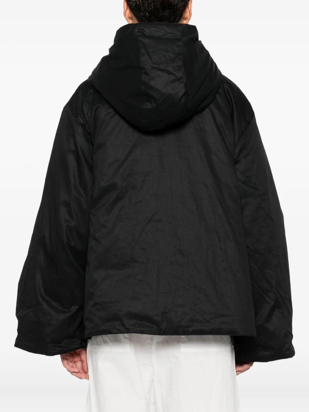 Back view of the Sallie Jacket in Black, featuring the hoodie and zip closure.