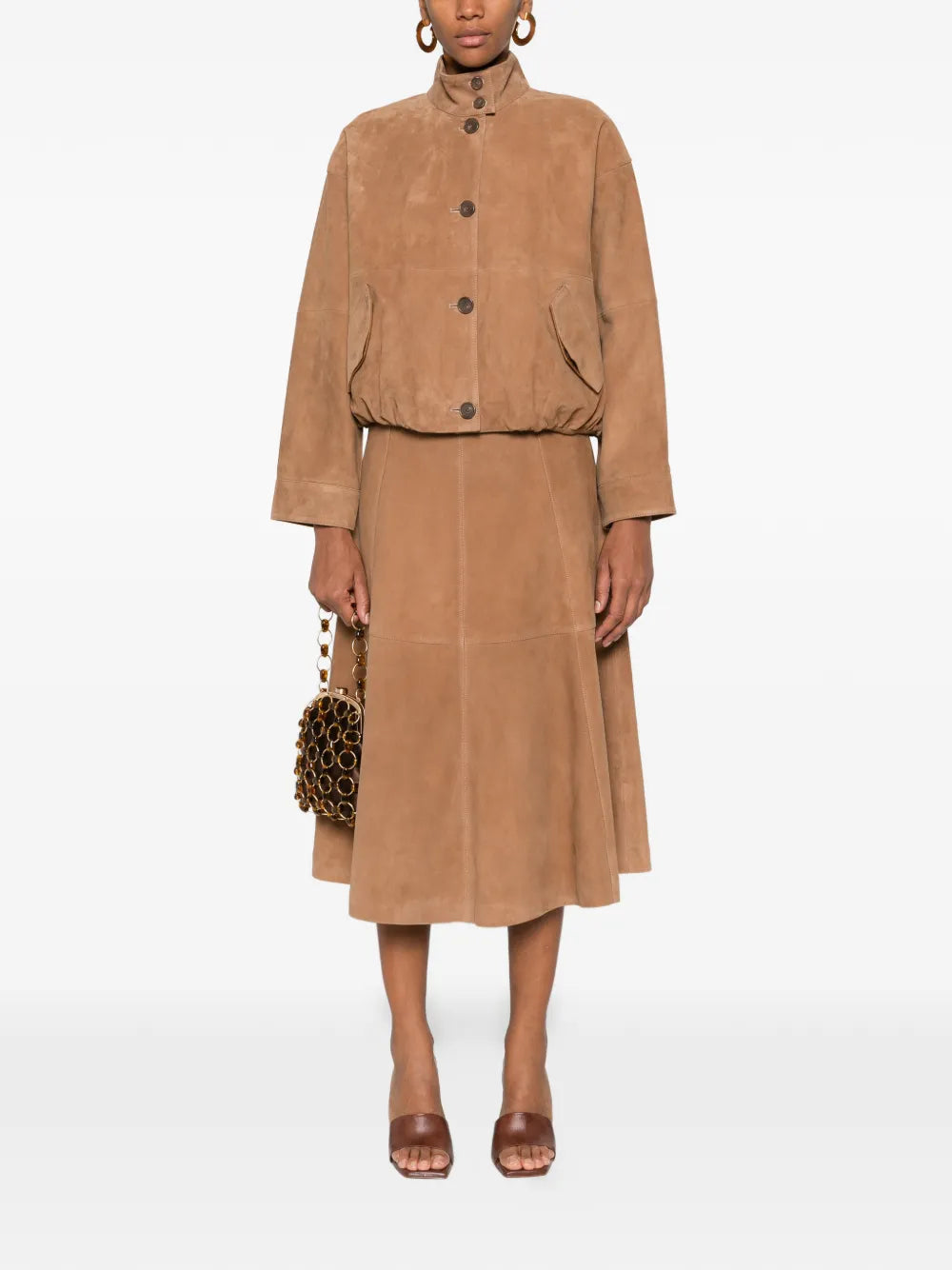 Close-up view of the Bonnie Midi Skirt in Camel, showcasing the luxurious goat suede fabric.