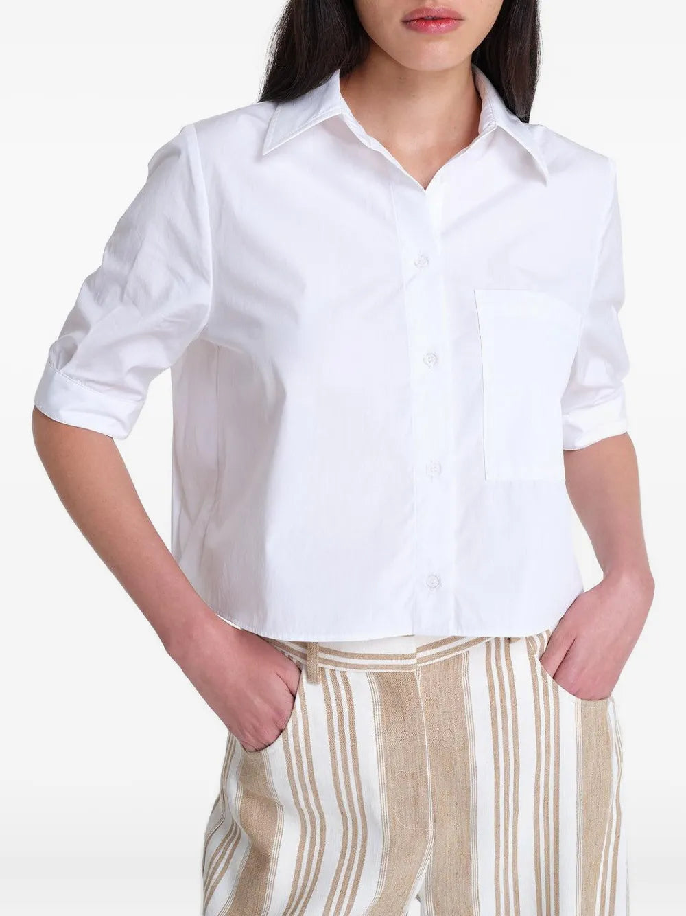 A flat lay of the Short Lived Shirt in White with a chest patch pocket and french cuffs.
