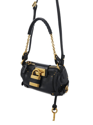 Chloé's Small Paddington Chain Bag in Black displayed with adjustable leather strap for versatile styling options.