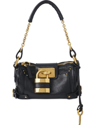 Small Paddington Chain Bag in Black by Chloé showcasing stylish grained buffalo leather design with oversized padlock detail.