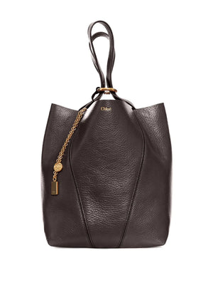 Chloé Spin Tote in Kohl Brown displayed against a neutral background, emphasizing its elegant silhouette and dimension.