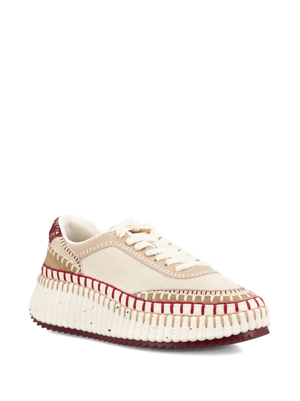 Close-up view of Chloé Nama Sneakers in Beige/Purple showcasing the intricate blanket stitching and Chloé logo embroidery.