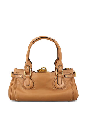 Stylish shot of the Mustang Brown Paddington Bag by Chloé, featuring the unique zip opening and luxurious leather.