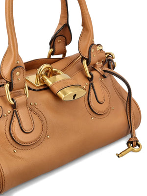 Chloé Paddington Bag in Mustang Brown displayed with dimensions, emphasizing its lightweight silhouette and Italian craftsmanship.