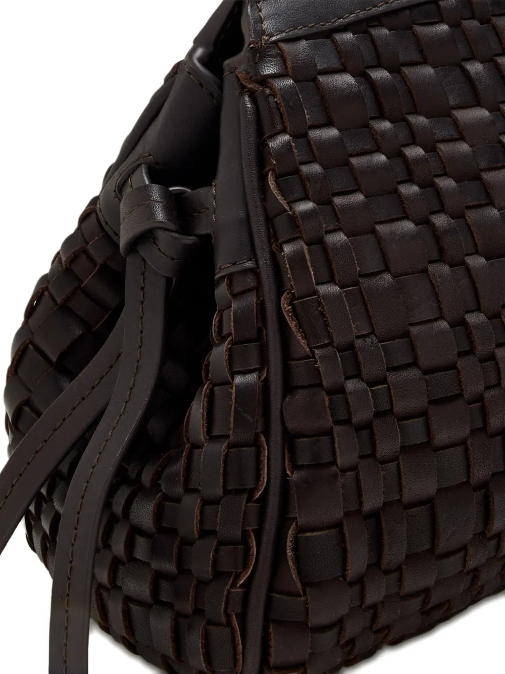 Close-up of the Maude Soft Clutch in Espresso Woven, showcasing the woven leather texture and knotted tie detail of this trendy clutch.